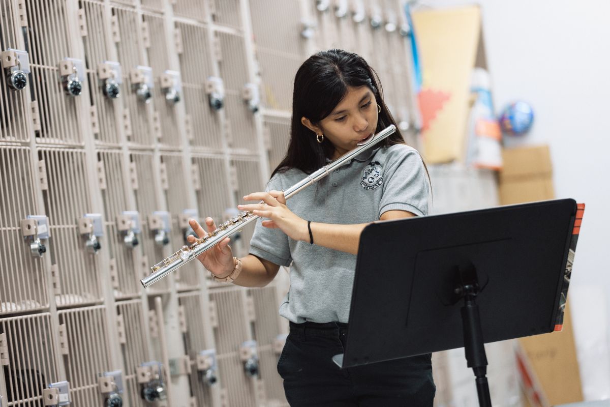 Picture of a girl playing the flute.