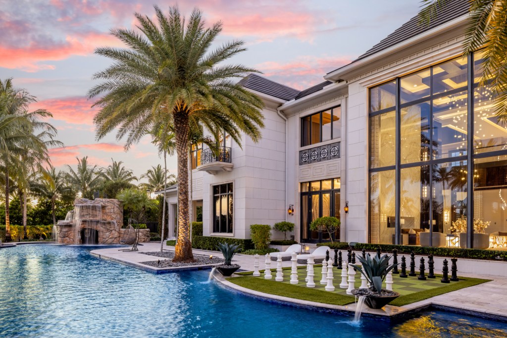 Backyard pool area with a large area to play chess