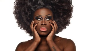 headshot of Bob the Drag Queen wearing an afro and makeup