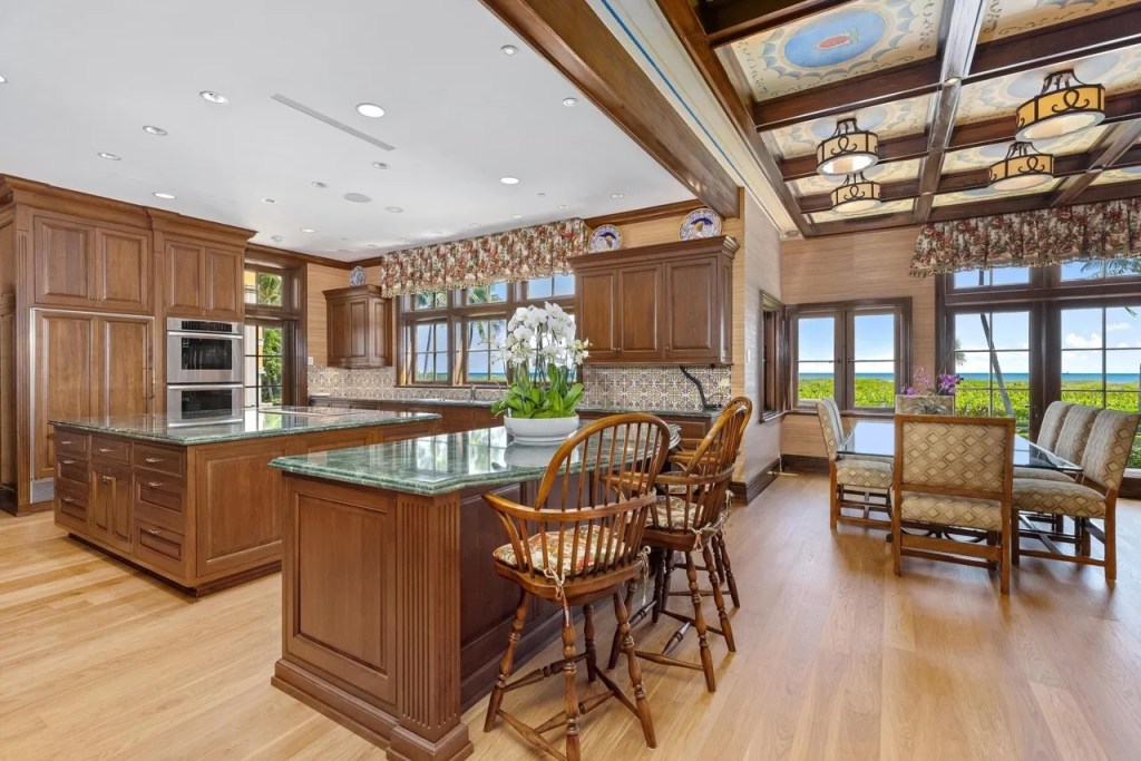 a brown-toned kitchen with ample countertop space and seating