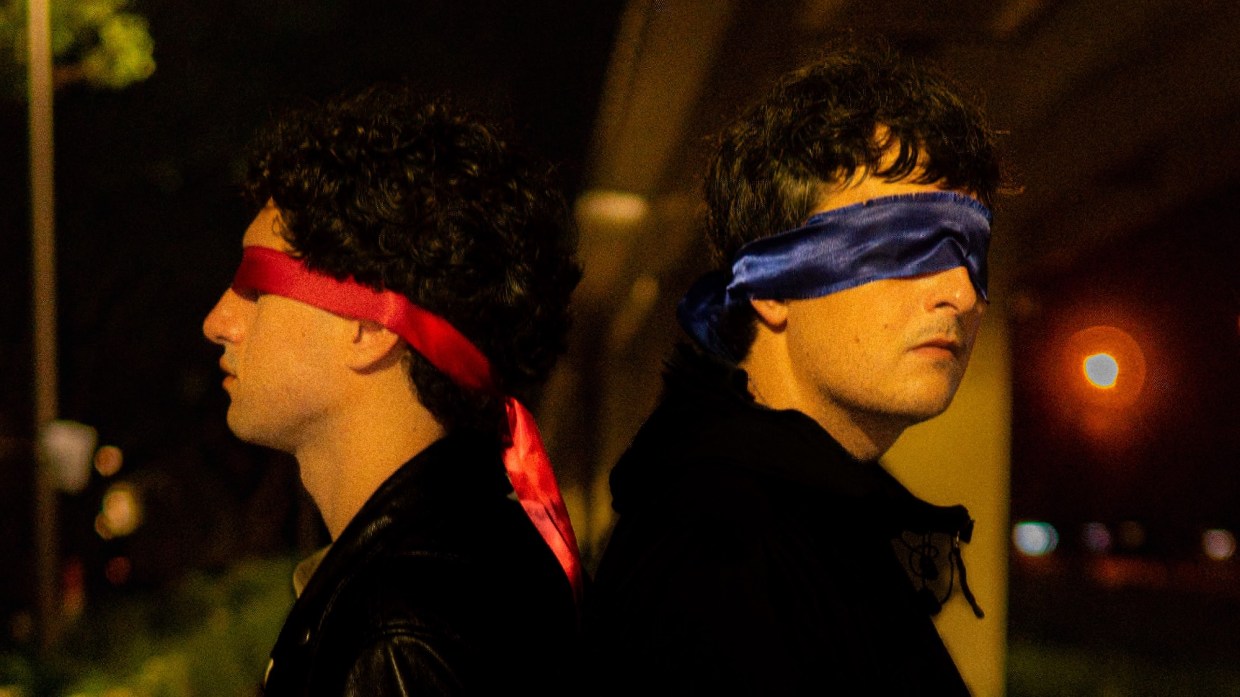 two men with their eyes blindfolded