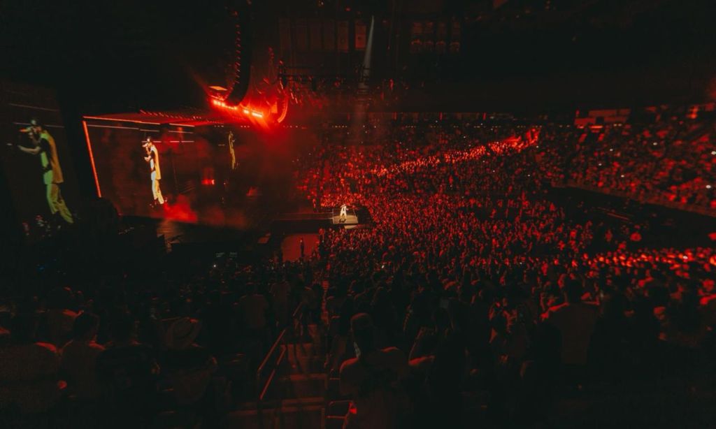 Photo of a stadium packed with people during a concert