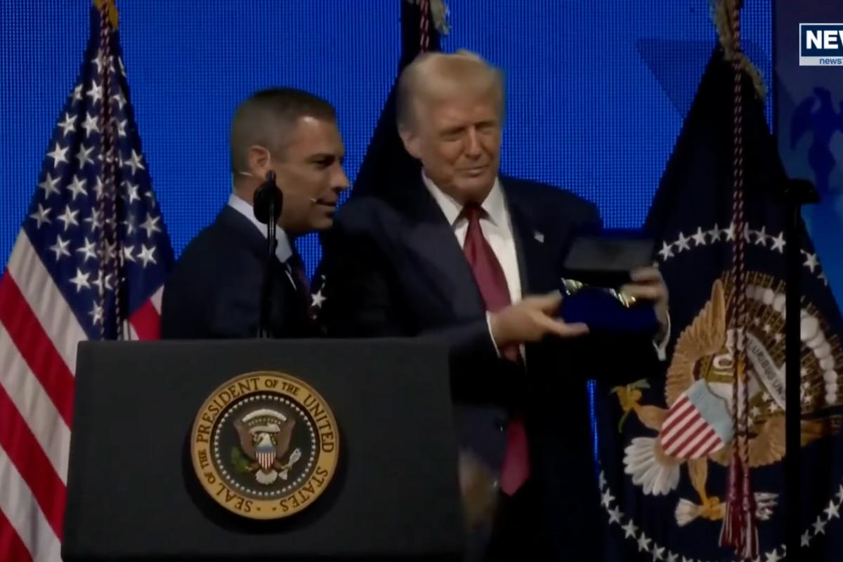 Miami Mayor Francis Suarez and President Donald Trump pose for photos at the America Business Forum.
