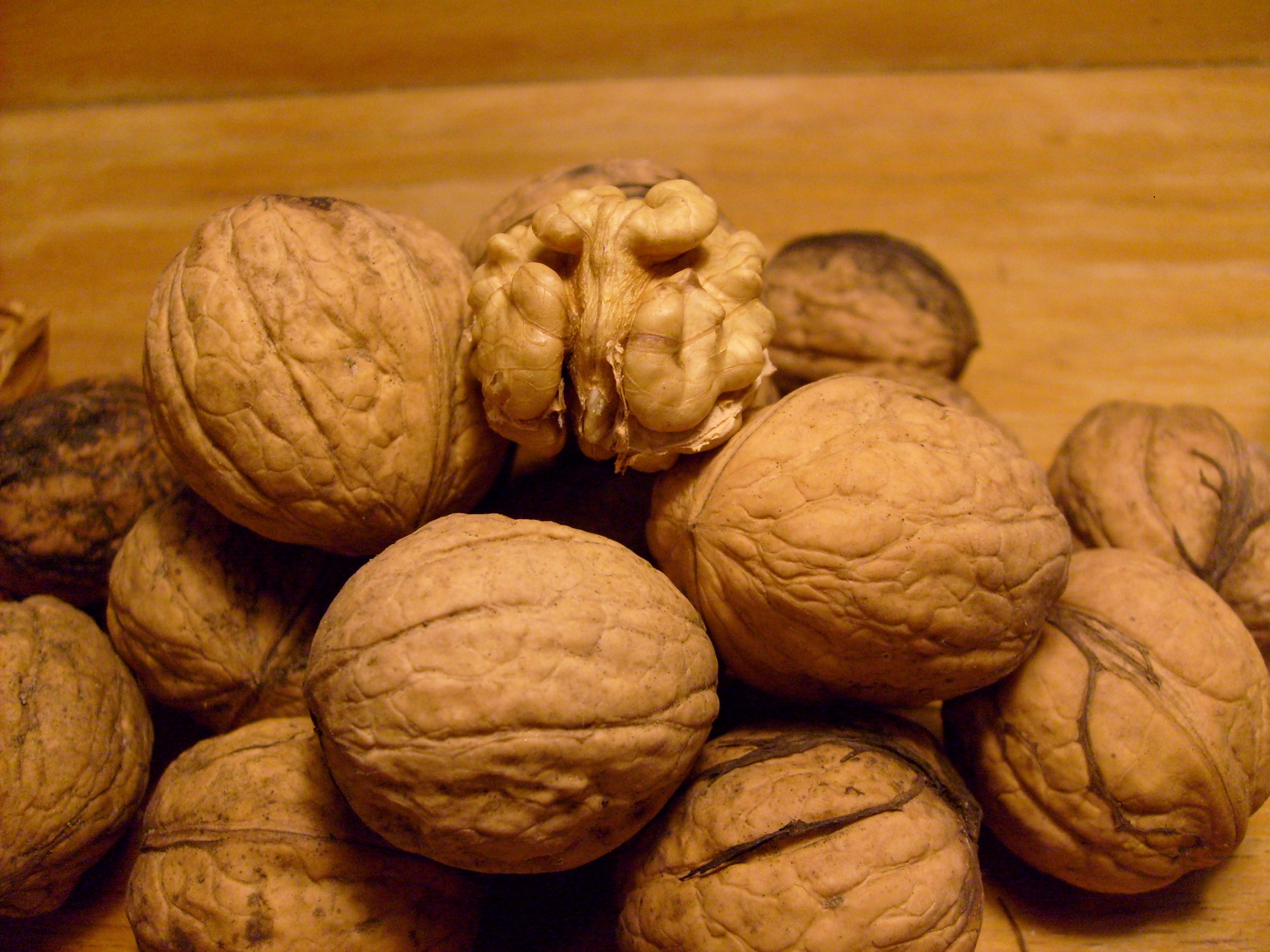 photo of a pile of walnuts on top of a table