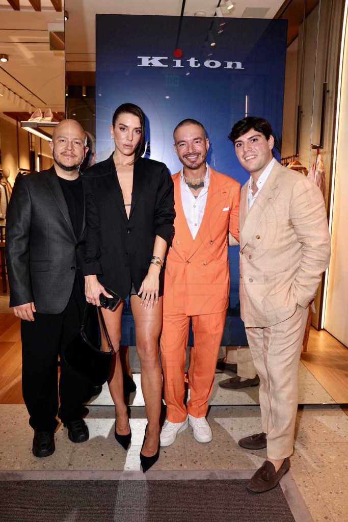 photo of Andres Lopez, Valentina Ferrer, J Balvin, and Ulderico Klain posing beneath a sign reading, "Kiton"