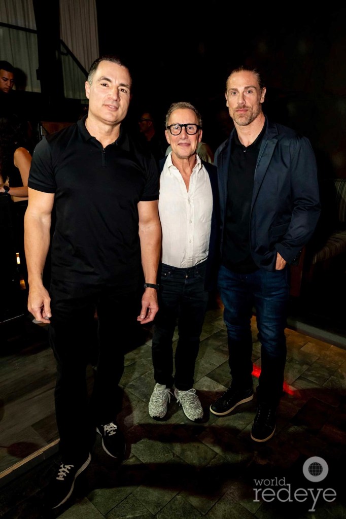 photo of three men posing together