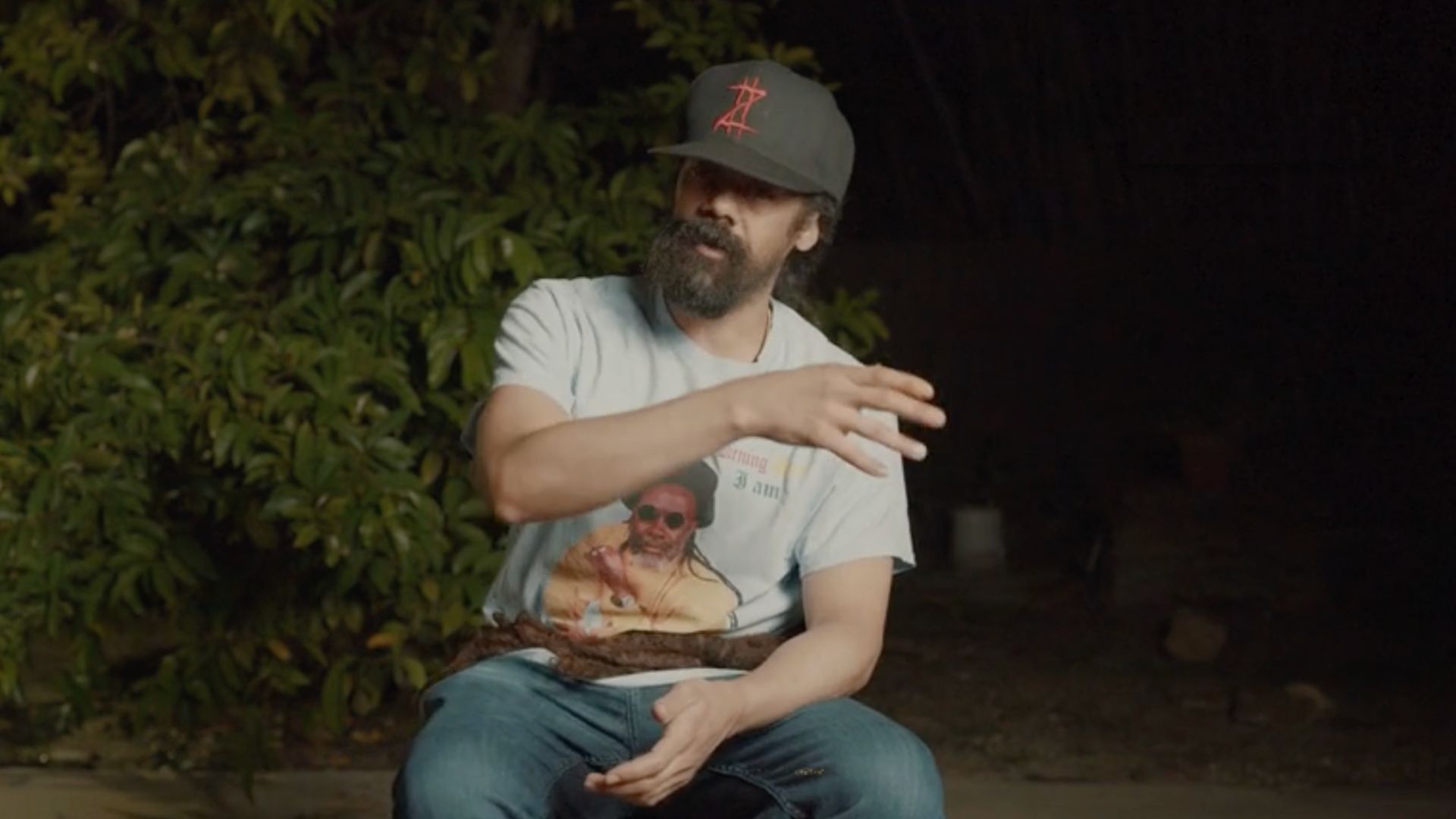 Photo of a man talking sitting on a chair