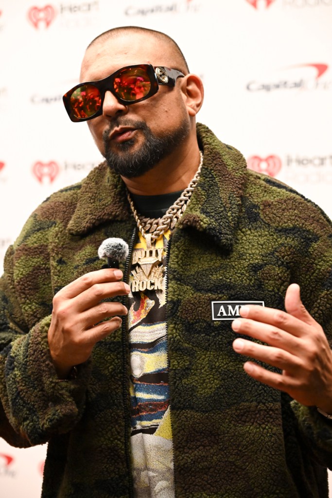 Photo of a man holding a microphone. 