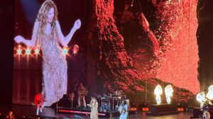 photo of Shakira bellydancing onstage with a Jumbotron projecting her image behind her