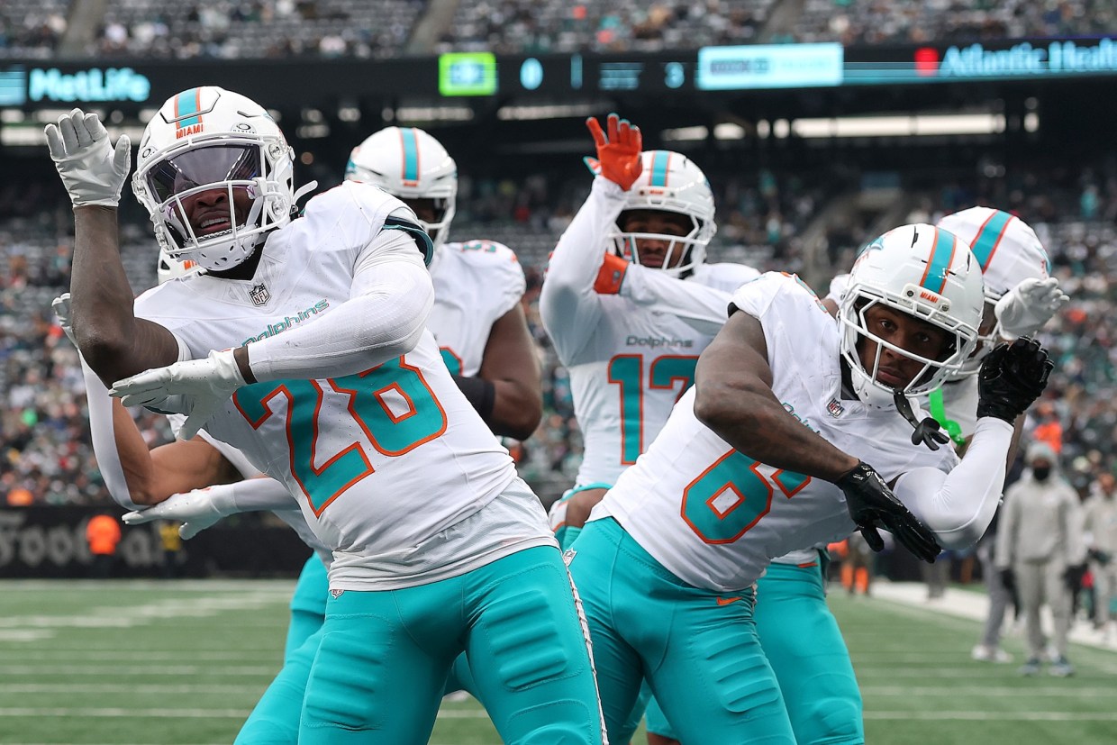 Miami Dolphins players participate in an end-zone celebration after scoring a touchdown vs. the New York Jets