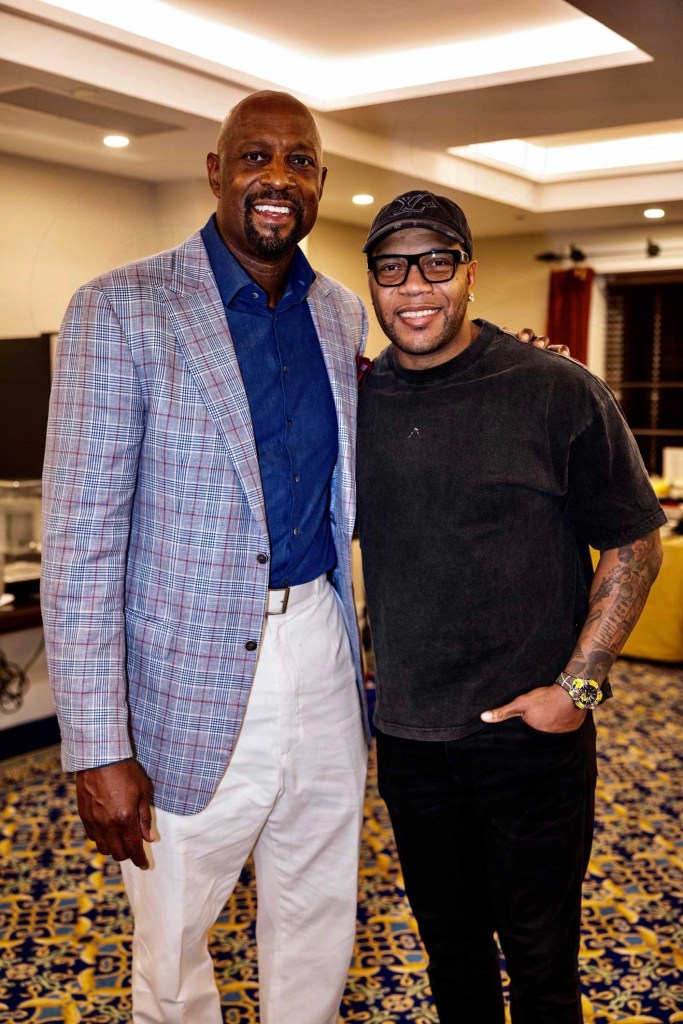 photo of former basketball player Alonzo Mourning and rapper Flo Rida posing together