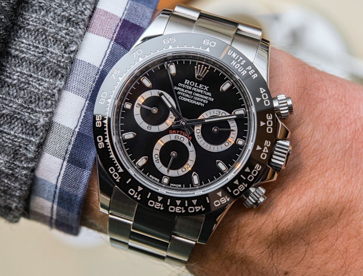 Rolex Cosmograph Daytona Watch Black Ceramic Bezel on a man's left wrist