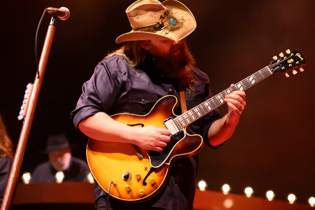A country guitar player on stage