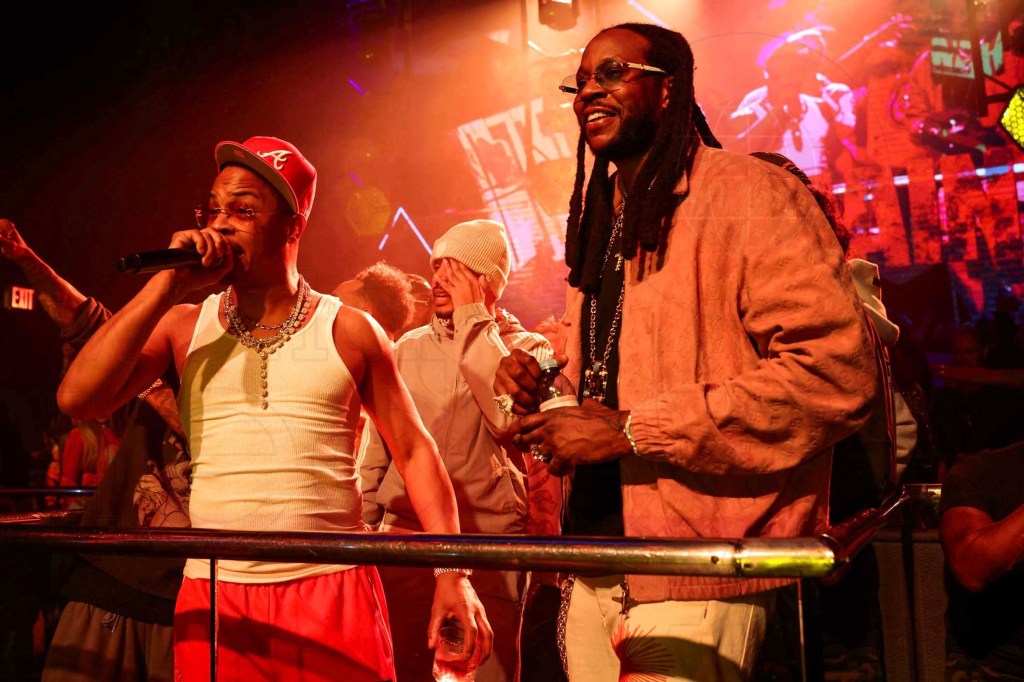 photo of rappers T.I. and 2 Chainz performing onstage