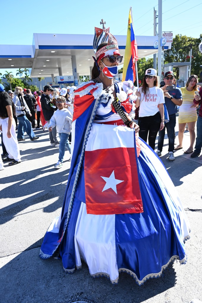 photo of a woman wearing a ballgown with the Cuban flag on it