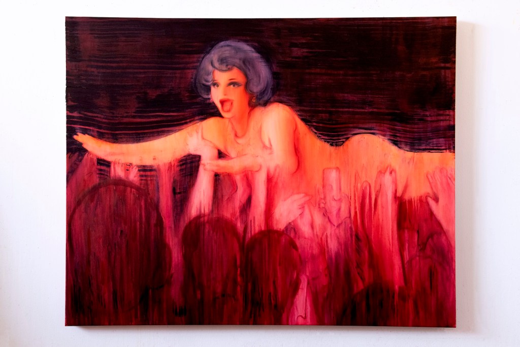 photo of a painting of a woman crowdsurfing