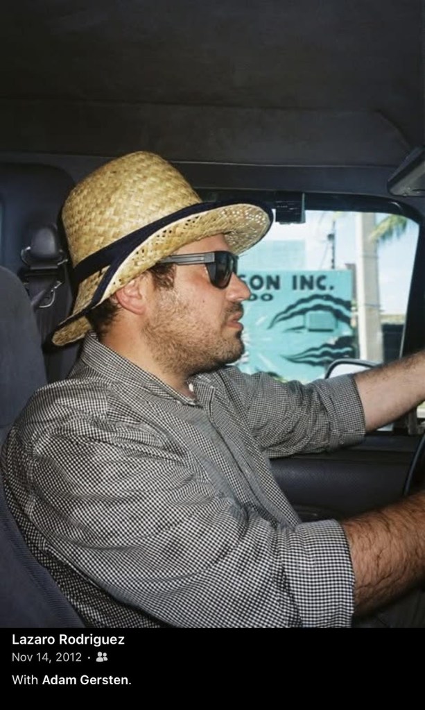 screenshot of a Facebook photo showing a man in a straw hat driving. The caption reads, "Lazaro Rodriguez with Adam Gersten"