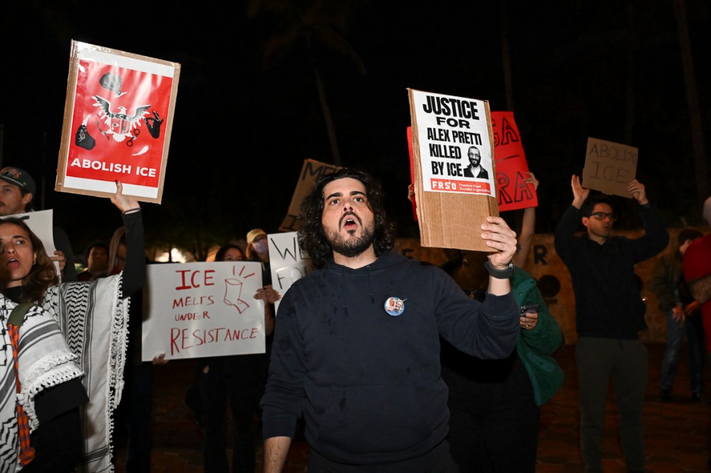 photo of protesters holding signs