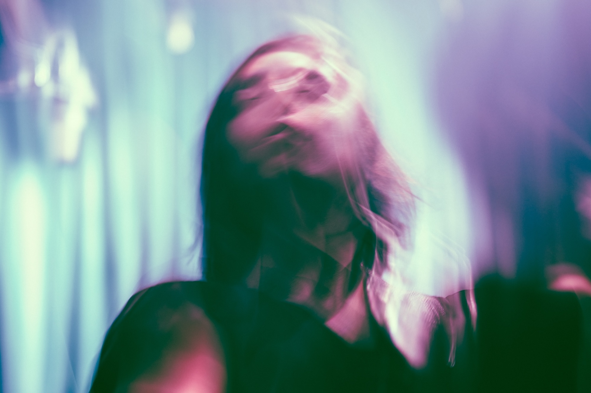 photo with a blurry, psychedelic effect of a long-haired man's face