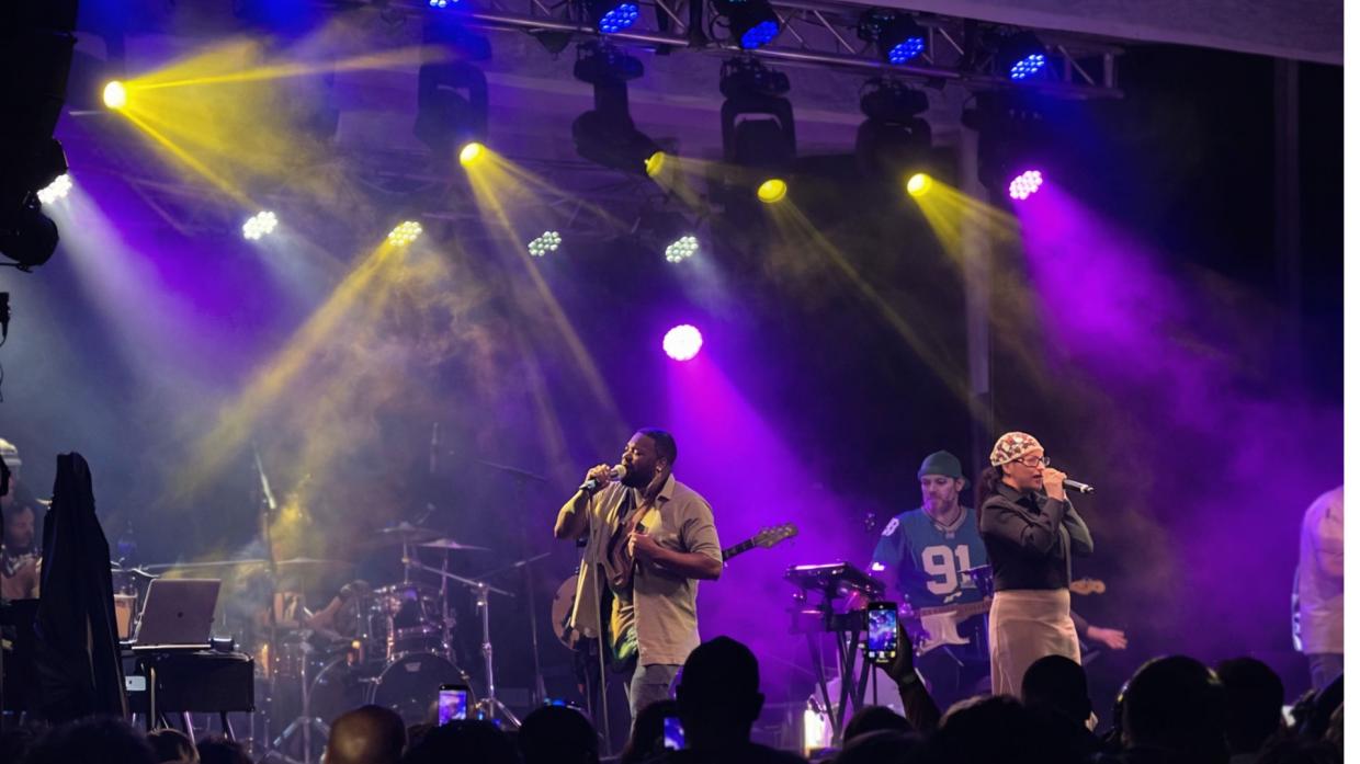 Photo of a band performing on a stage