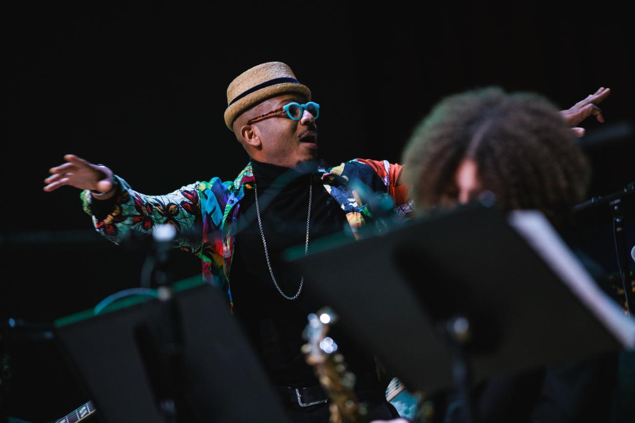 Photo of an orchestra conductor on stage