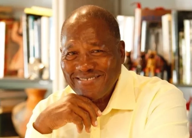 headshot of historian Marvin Dunn in a light yellow button-down shirt