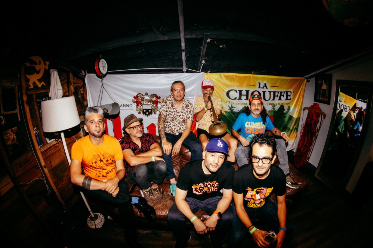 Photo of a group of men sitting on a couch