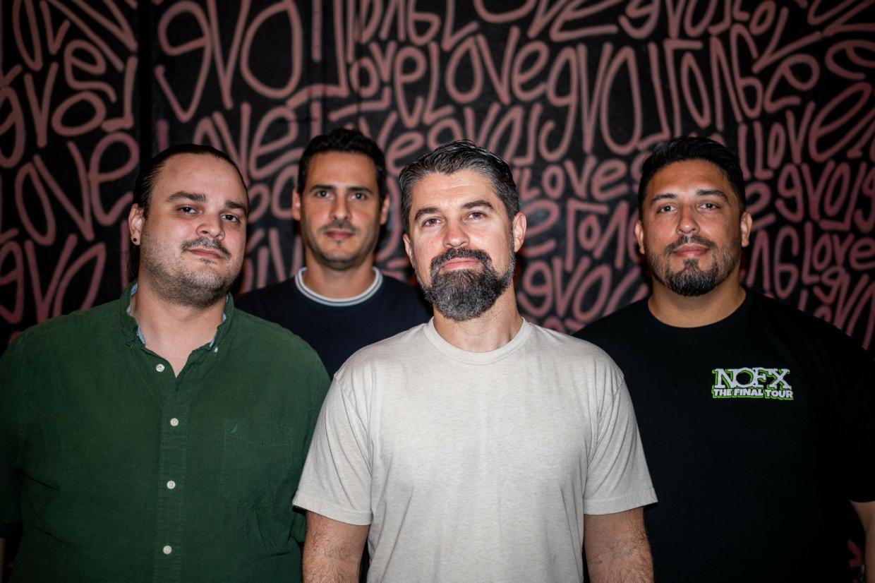 Photo of a band posing for the camera