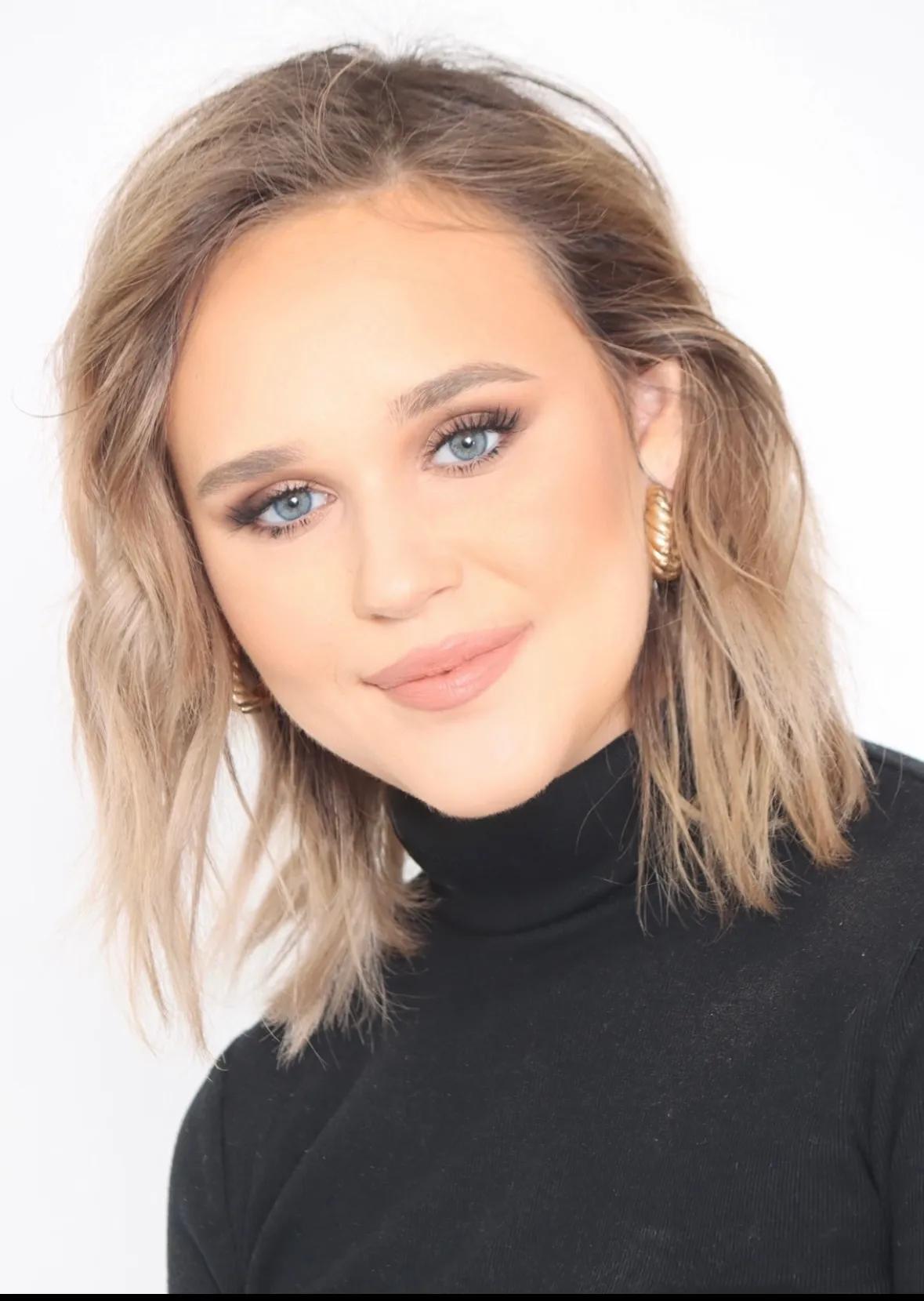 Portrait of a woman wearing a black turtleneck