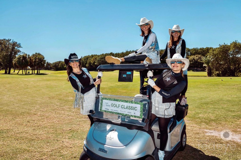 photo of four women wearing fringed cowboy hats hanging out of a golf cart on a golf course
