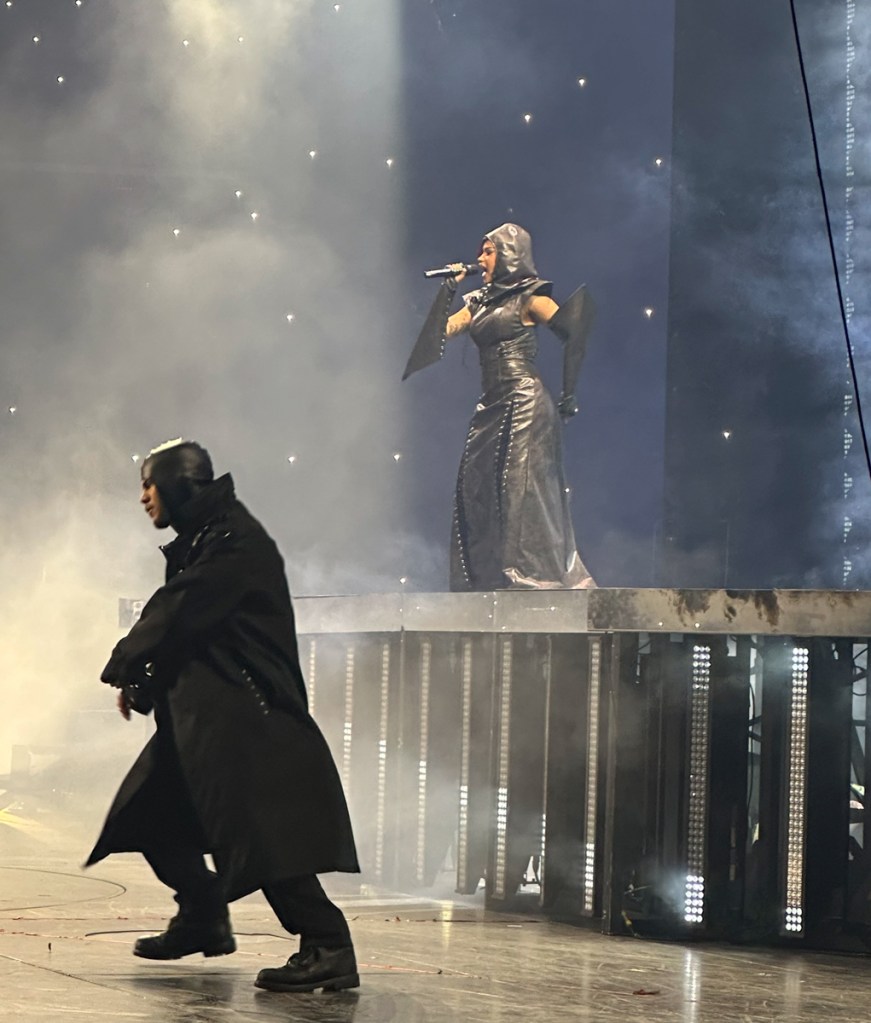 Photo of Cardi B on stage wearing a leather outfit