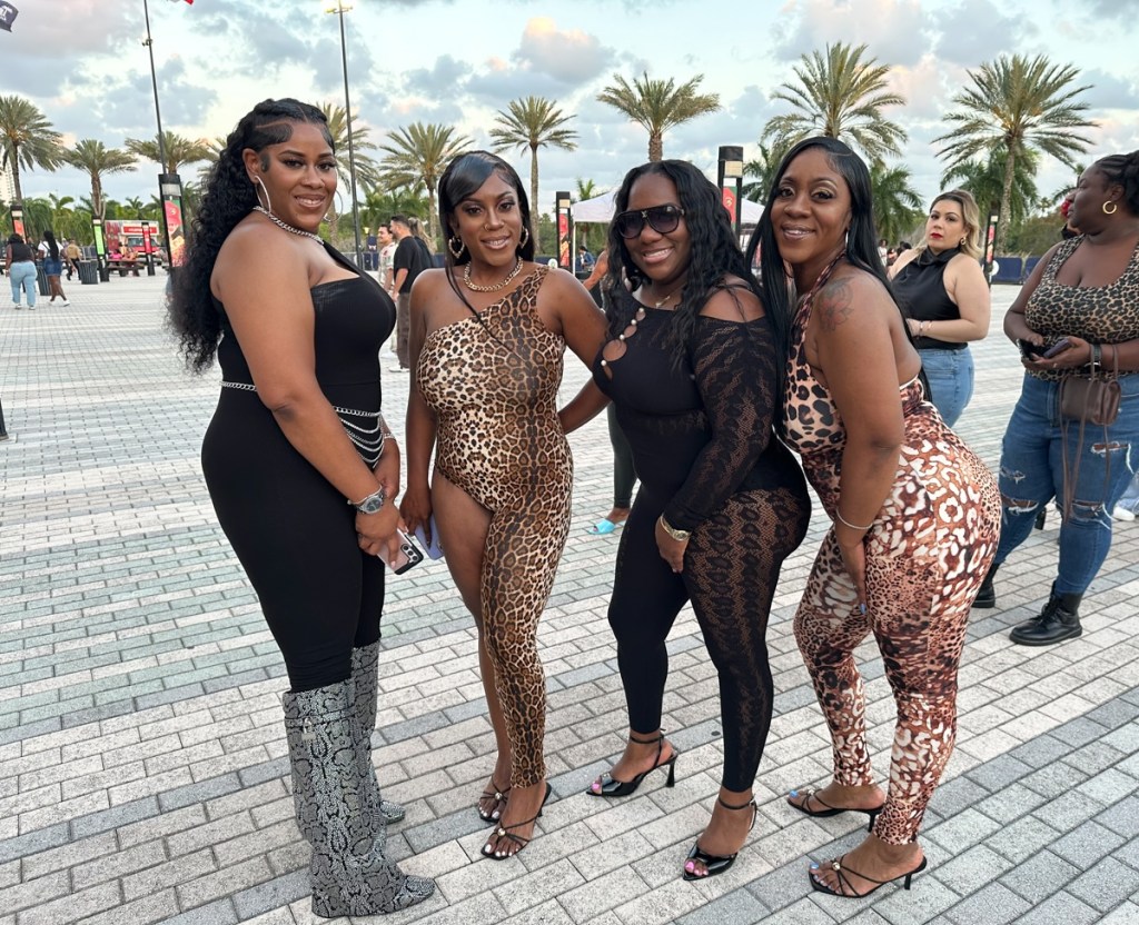 Photo of Fans at the Cardi B show wearing animal print outfits. 