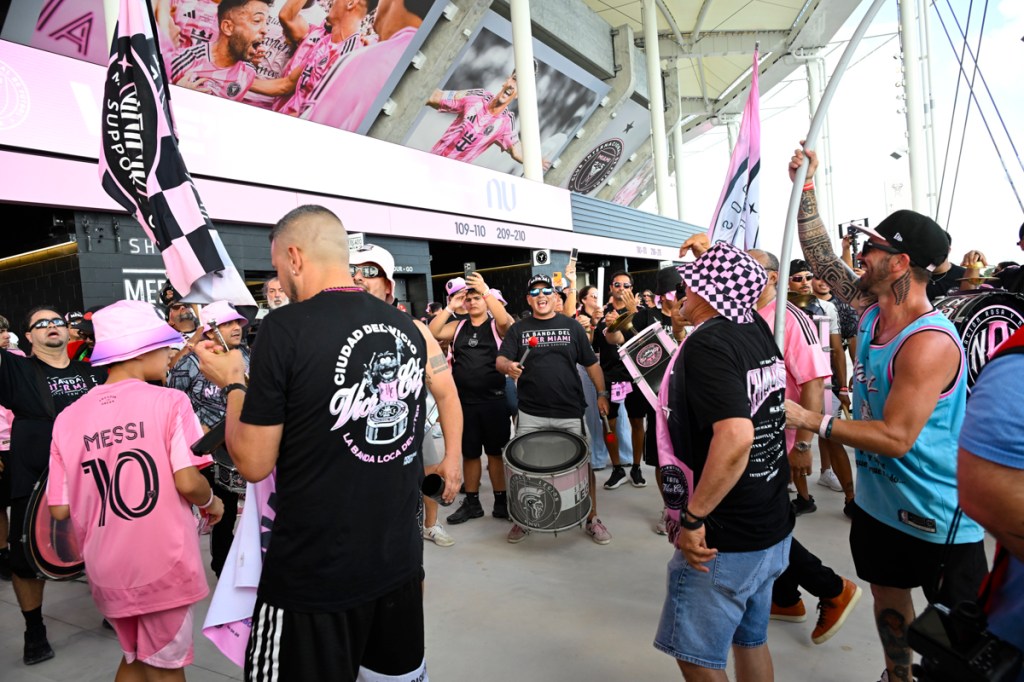 photo of fans partying with drums outside Nu Stadium