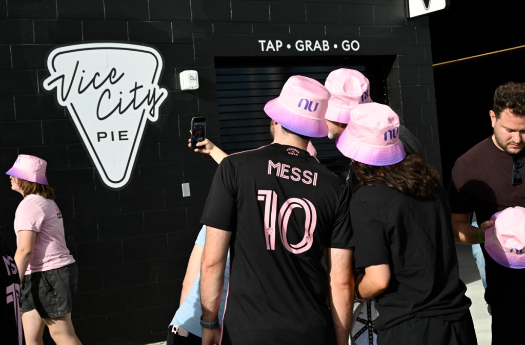photo of fans wearing Inter Miami bucket hats and tshirts