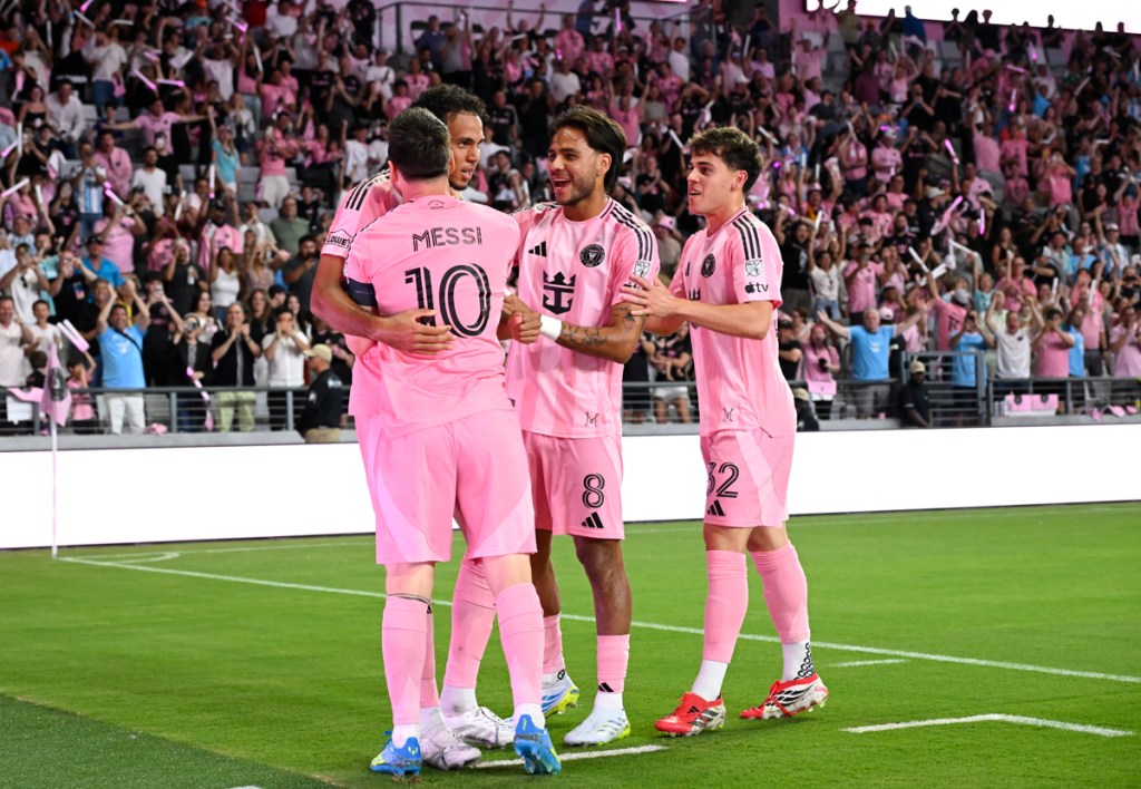 photo of Inter Miami team hugging on the field at Nu Stadium