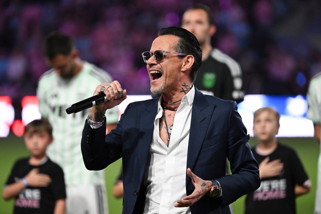 photo of Marc Anthony singing at a soccer game