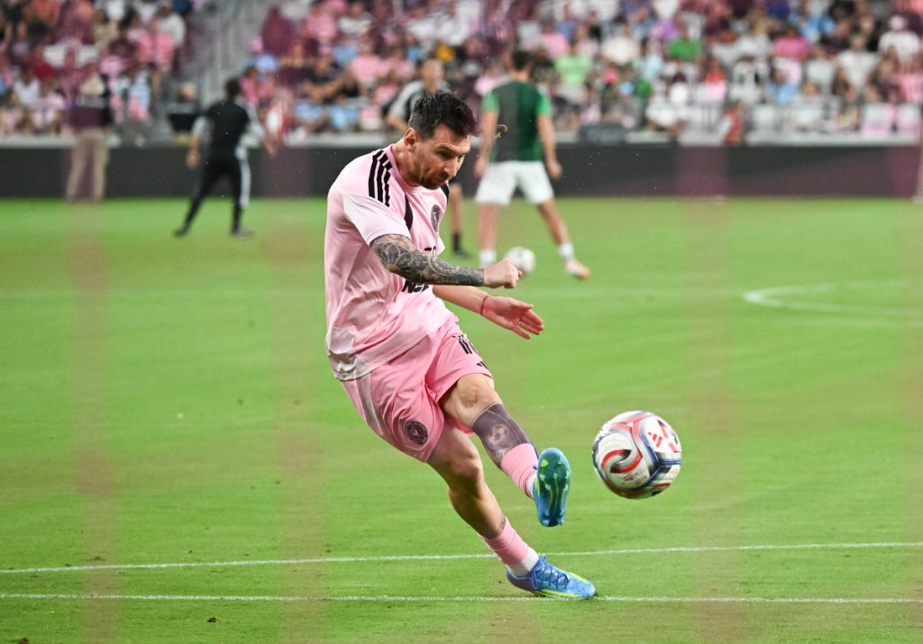 photo of Lionel Messi kicking a soccer ball inside Miami Freedom Park