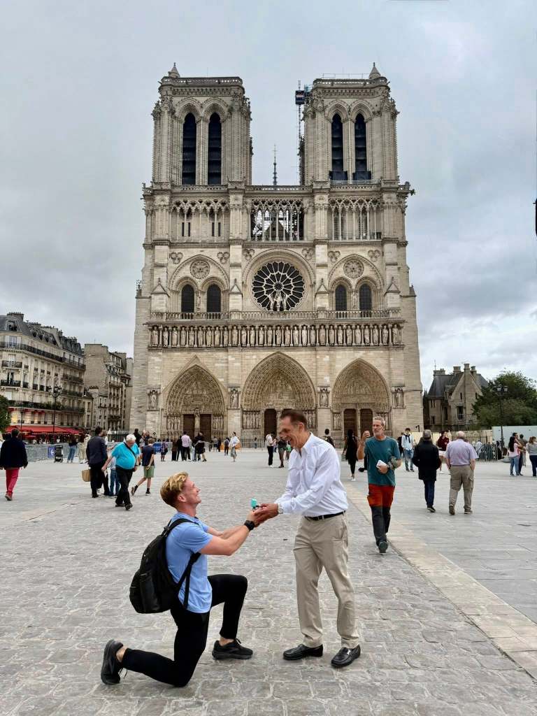 Danny Curran proposing to Dean Trantalis in front a church in Europe.