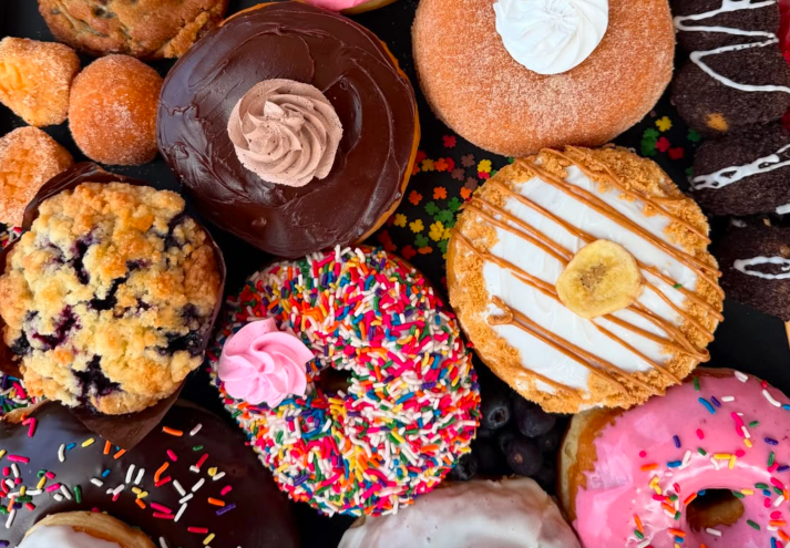 an assorted box of colorful doughnuts