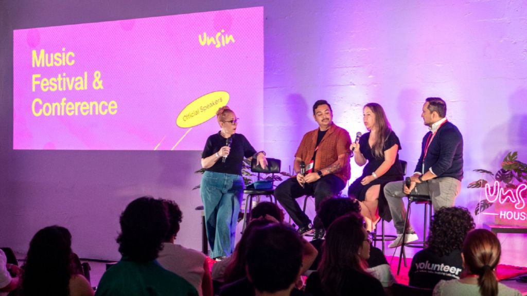 Photo of a panel of speakers in Miami. 