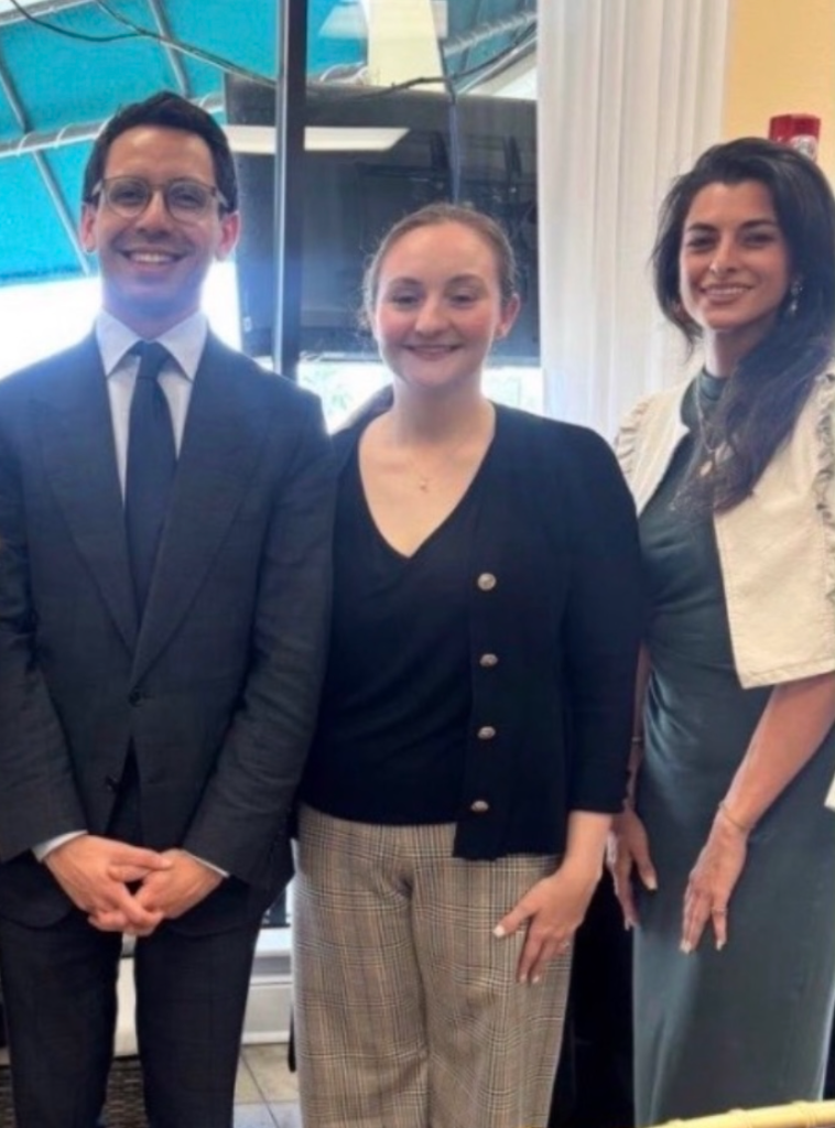 phone photo of Florida gubernatorial candidate James Fishback posing with former campaign manager Emma Stanley Wright and former campaign volunteer Gianna Tagliarini