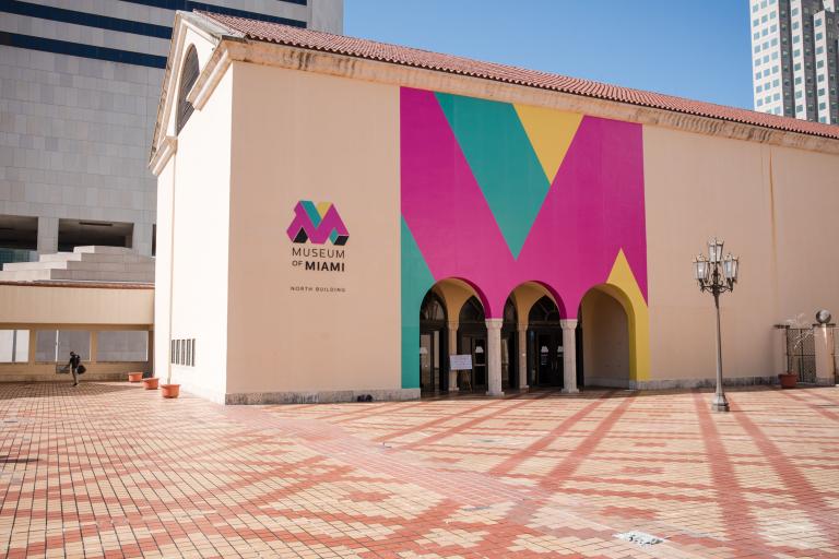 photo of the Museum of Miami's facade flanked by buildings in downtown Miami