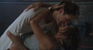 photo of actors Robert Pattinson and Zendaya passionately embracing in a film still from "The Drama"