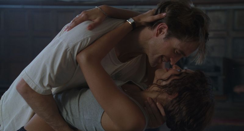photo of actors Robert Pattinson and Zendaya passionately embracing in a film still from "The Drama"