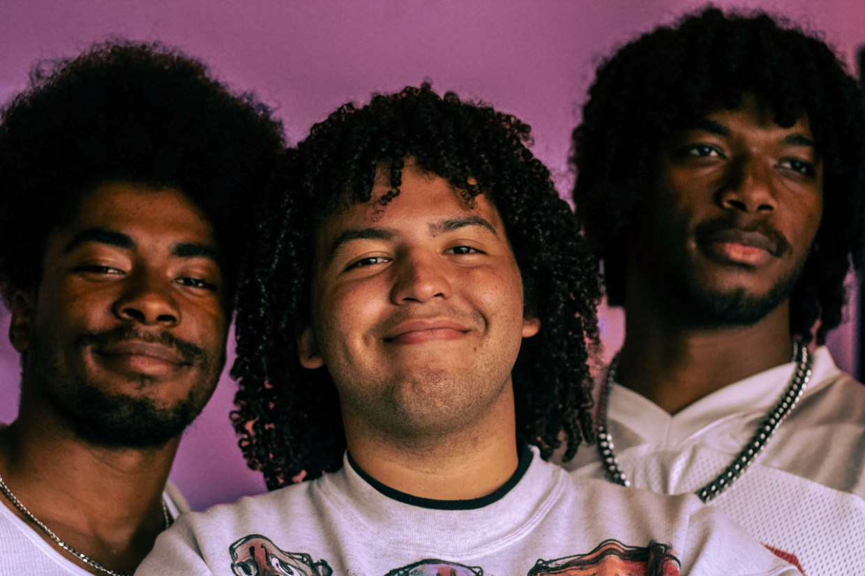 Photo of three young Miami musicians posing for the camera.