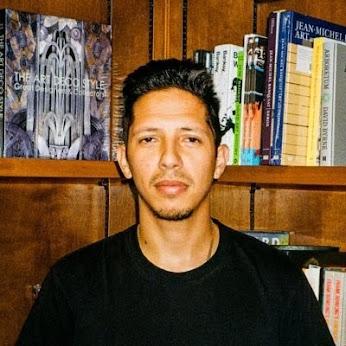 Photo of a man wearing a black t-shirt