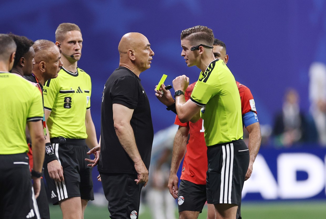Referee Francois Letexier shows a yellow card to Hossam Hassan, Head Coach of Egypt, during the FIFA World Cup 2026 Round of 16 match between Argentina and Egypt at Atlanta Stadium on July 07, 2026 in Atlanta, Georgia.