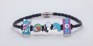 photo of a bracelet with charms depicting symbols related to the FIFA World Cup and Miami
