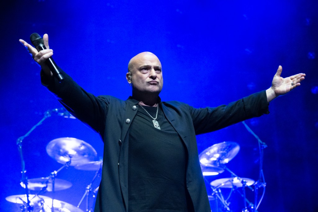 Photo of Disturbed performing on stage at Hard Rock live