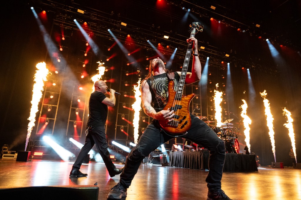 Photo of Disturbed performing on stage at Hard Rock live